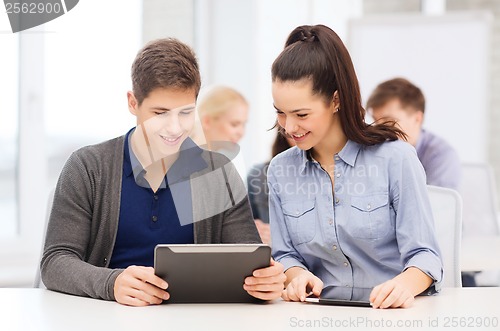 Image of students looking at tablet pc in lecture at school