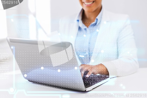 Image of businesswoman using her laptop computer