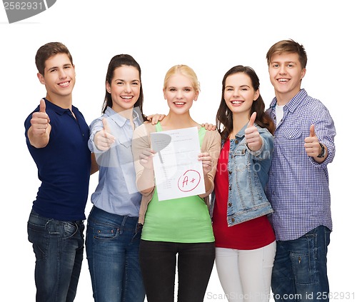 Image of group of students showing test and thumbs up