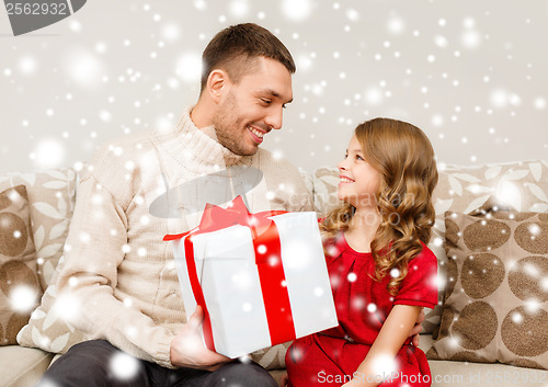 Image of smiling father and daughter looking at each other