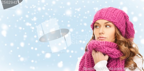 Image of beautiful woman in pink winter hat and muffler