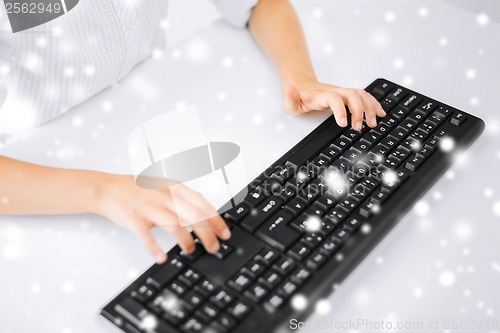 Image of student girls hands typing on keyboard