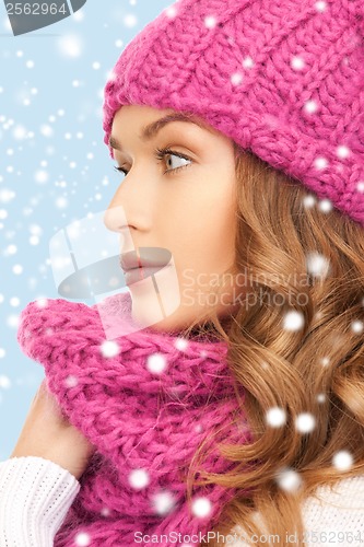 Image of beautiful woman in pink winter hat and muffler
