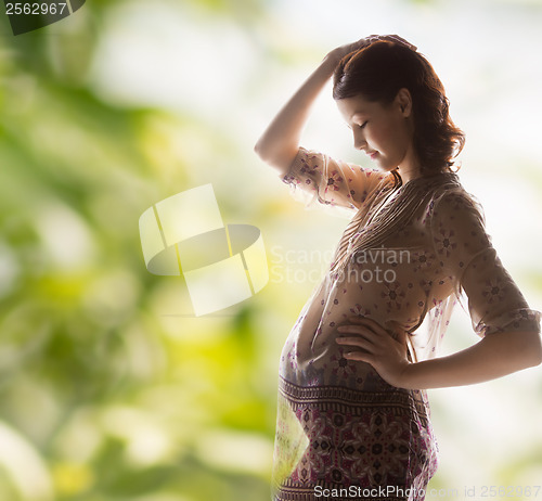 Image of silhouette picture of pregnant beautiful woman