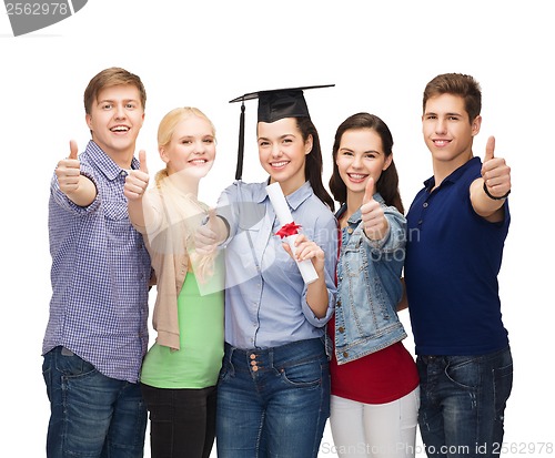 Image of group of students with diploma showing thumbs up