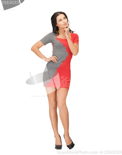 Image of pensive woman in red dress