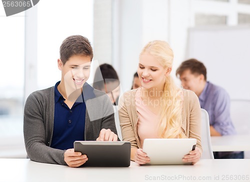 Image of students looking at tablet pc in lecture at school