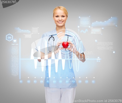 Image of smiling female doctor or nurse with heart