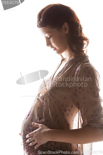 Image of silhouette picture of pregnant beautiful woman