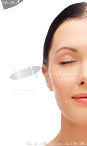 Image of relaxed young woman with closed eyes