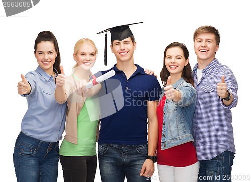 Image of group of students with diploma showing thumbs up