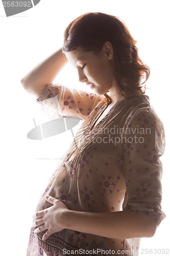 Image of silhouette picture of pregnant beautiful woman