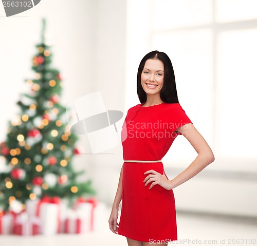 Image of smiling young woman in red dress