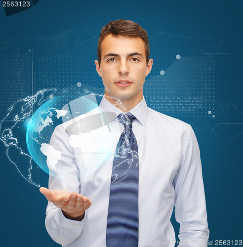 Image of man holding virtual sphere globe on the palm