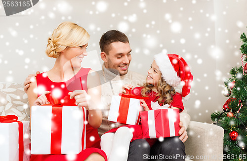 Image of happy family opening gift boxes