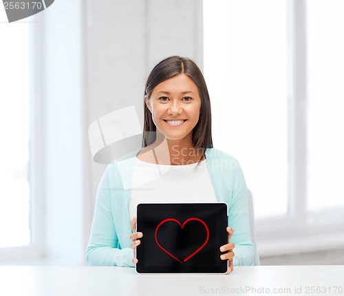 Image of smiling woman with tablet pc