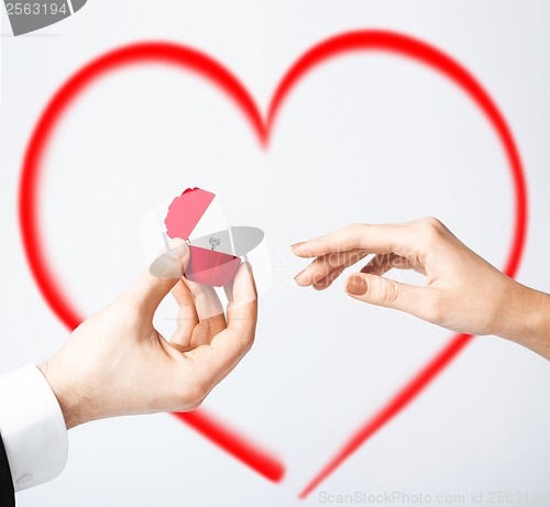 Image of couple with wedding ring and gift box