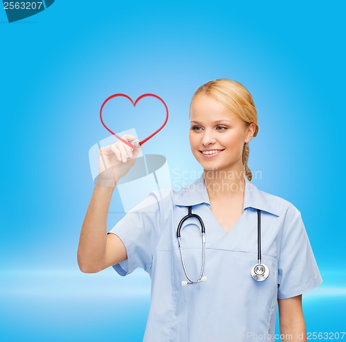 Image of doctor or nurse drawing red heart