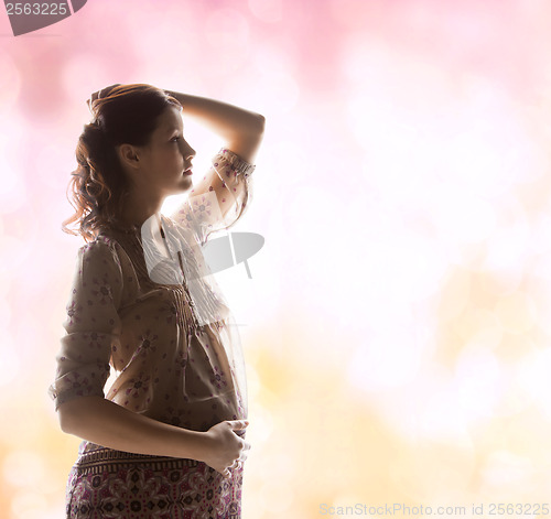 Image of silhouette picture of pregnant beautiful woman