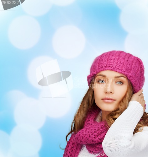 Image of woman in pink hat and scarf