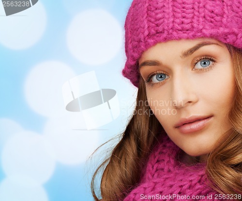 Image of woman in pink hat and scarf