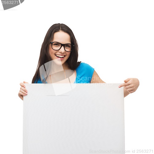 Image of smiling girl with eyeglasses and white blank board