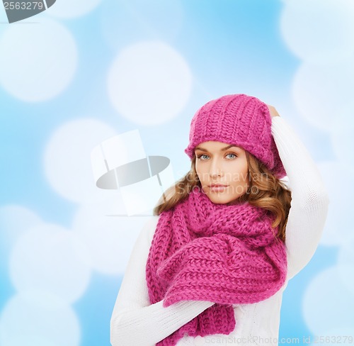 Image of woman in pink hat and scarf