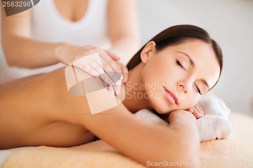 Image of beautiful woman in spa having massage