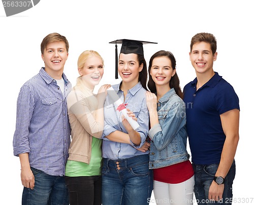 Image of group of standing smiling students with diploma