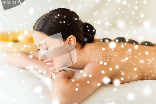 Image of woman in spa with hot stones