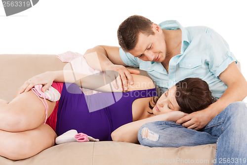 Image of happy expecting parents at home
