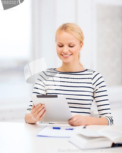 Image of student with tablet pc computer and notebook