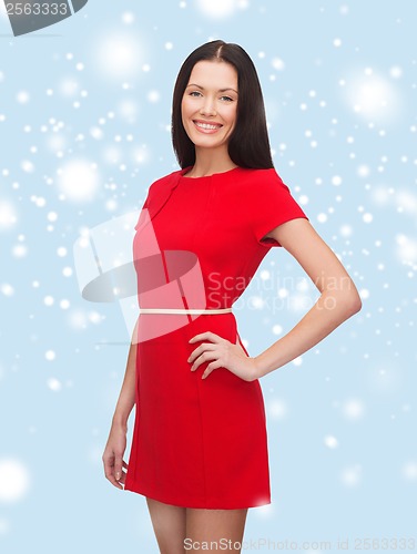 Image of smiling young woman in red dress