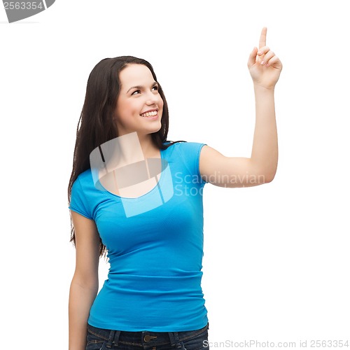 Image of smiling teenager pointing her finger up