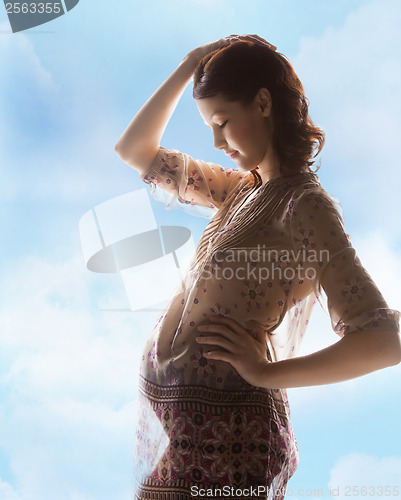 Image of silhouette picture of pregnant beautiful woman