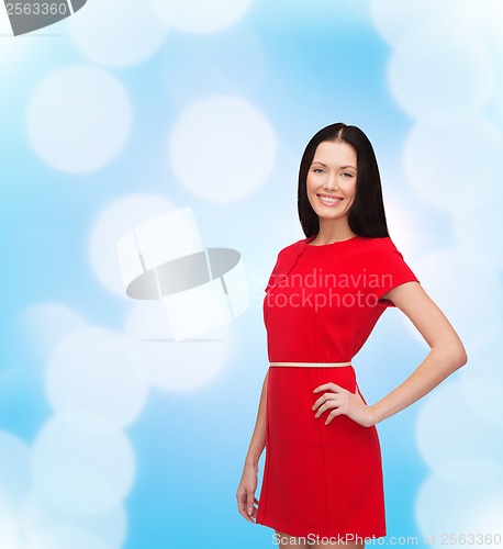 Image of smiling young woman in red dress