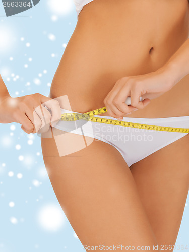 Image of woman with measure tape