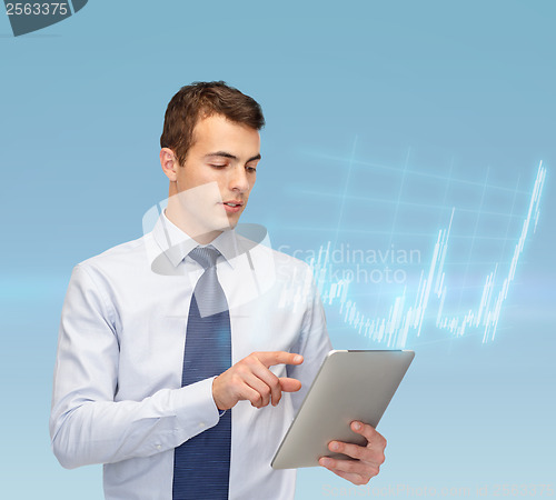 Image of buisnessman with tablet pc and forex chart