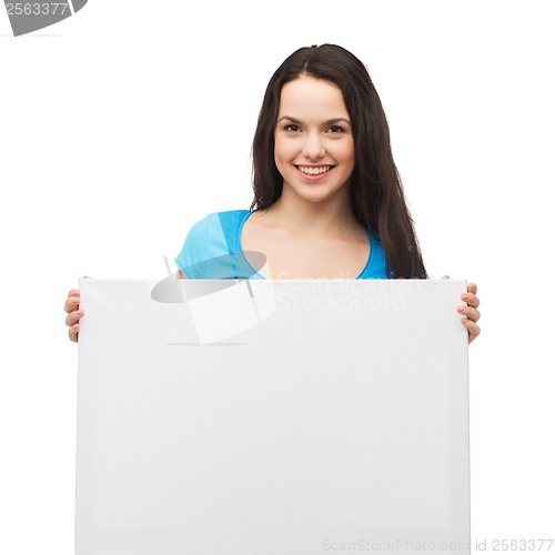 Image of smiling young girl with blank white board