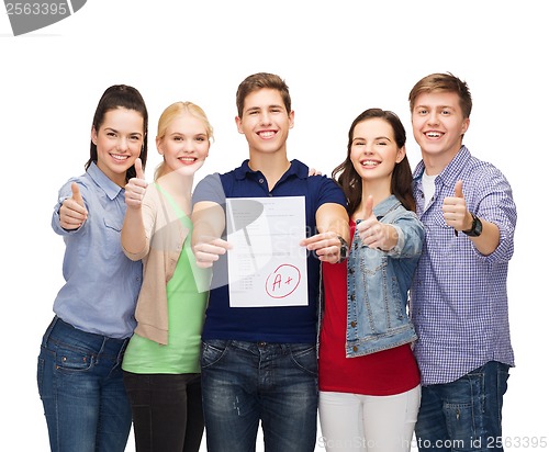 Image of group of students showing test and thumbs up