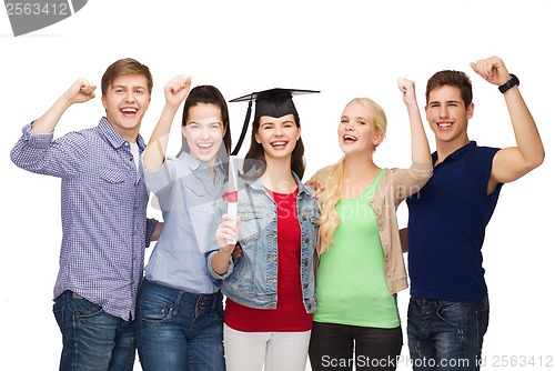 Image of group of standing smiling students with diploma