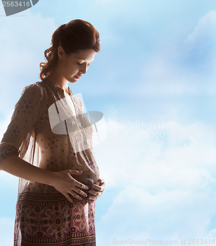 Image of silhouette picture of pregnant beautiful woman