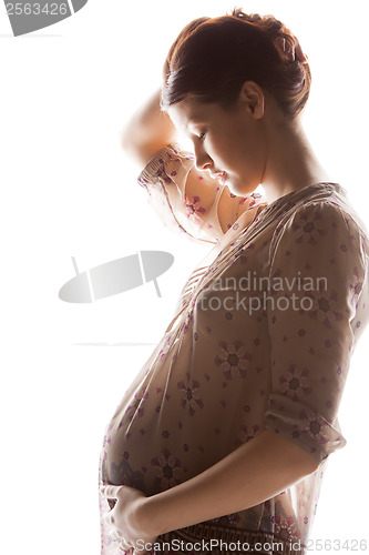 Image of silhouette picture of pregnant beautiful woman