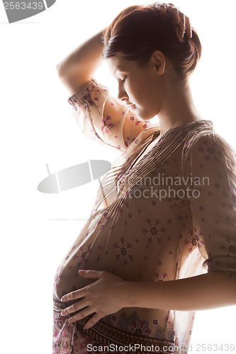 Image of silhouette picture of pregnant beautiful woman