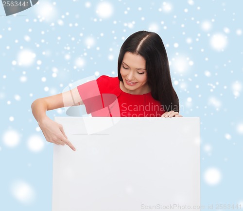 Image of smiling young woman with blank white board