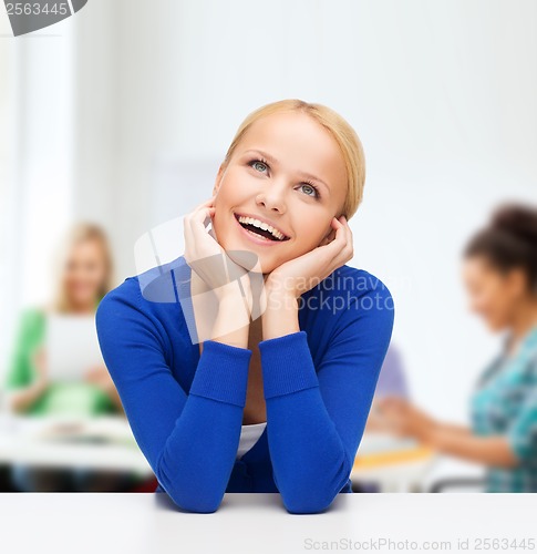 Image of happy woman dreaming and laughing