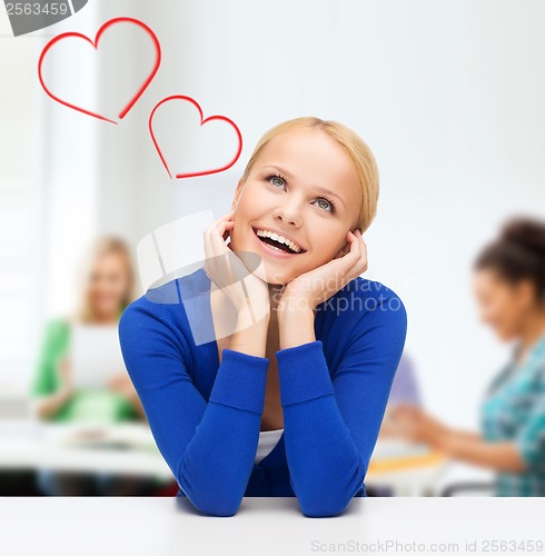 Image of happy woman dreaming and laughing