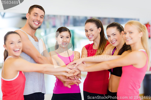 Image of group of people in the gym celebrating victory