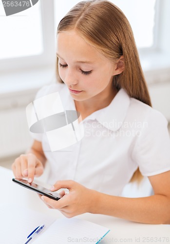 Image of girl with smartphone at school