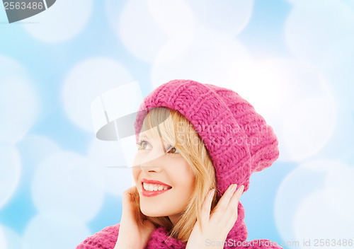 Image of woman in pink hat and scarf